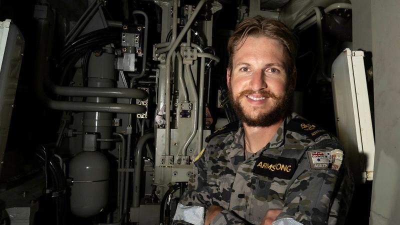 Leading Seaman Electronics Technician Ryan Armstrong conducts routine maintenance inside the 5 inch gun onboard HMAS Warramunga during Regional Presence Deployment 26-1.