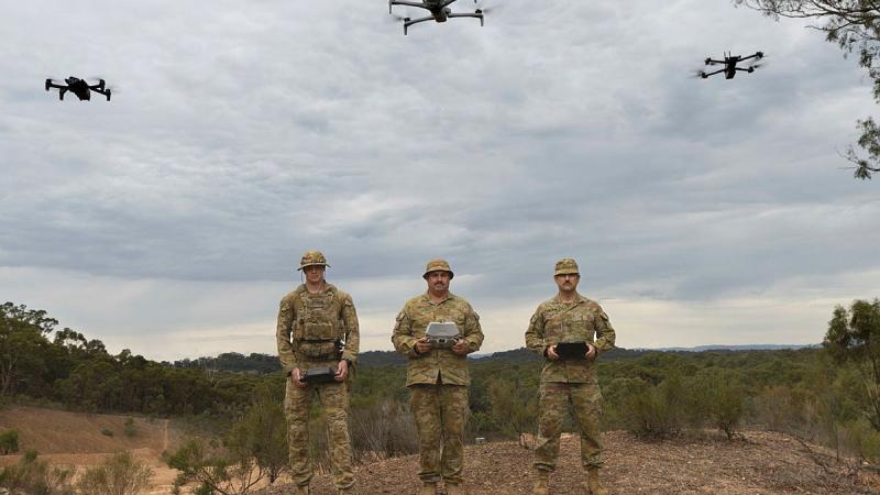 Corporal Henry Laurie, Sergeant Aaron Gray and Sergeant Chris Gagliardi fly drones at Puckapunyal Military Area. Photos:  Capt Krysten Clifton
