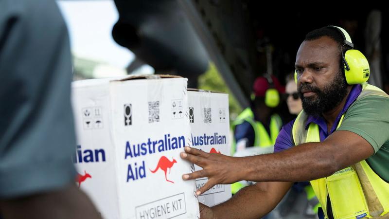 Solomon Island airport workers pack Australian aid onto a trailer at Munda International Airport following Tropical Cyclone Maila, 13 April 2026.