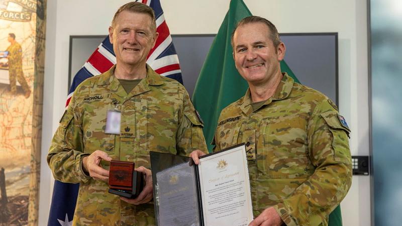 Major Dominic Nicholl presented the Second Federation Star by Commander of the 1st(Australian) Division Major General Ash Collingburn at Gallipoli Barracks, Enoggera.*image has been digitally altered for security reasons.
