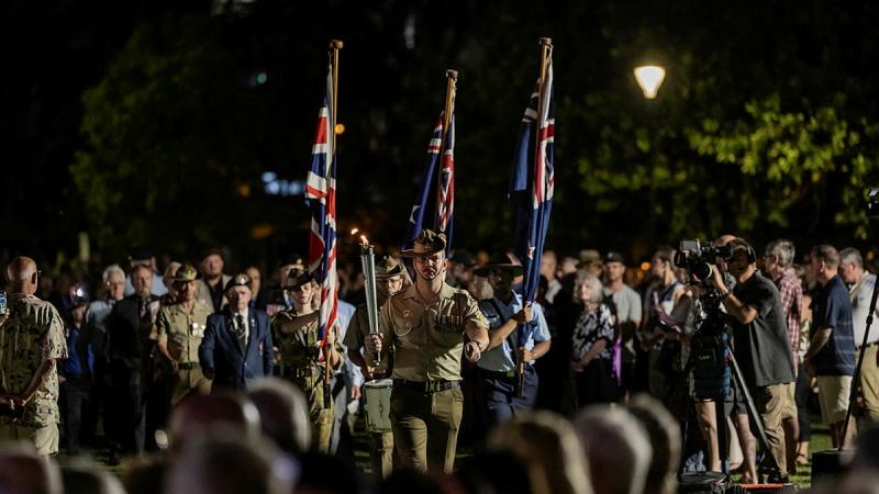 Personnel march into the Anzac Day 2026 dawn service.