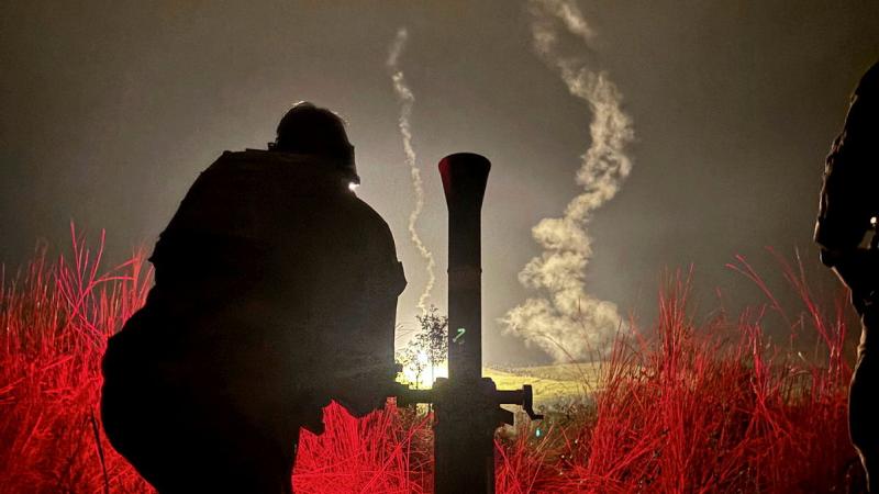 Australian Army soldiers from the First Battalion, Royal Australian Regiment mortar platoon fire illumination rounds as part of the combined mortar activity at Townsville Field Training Area.