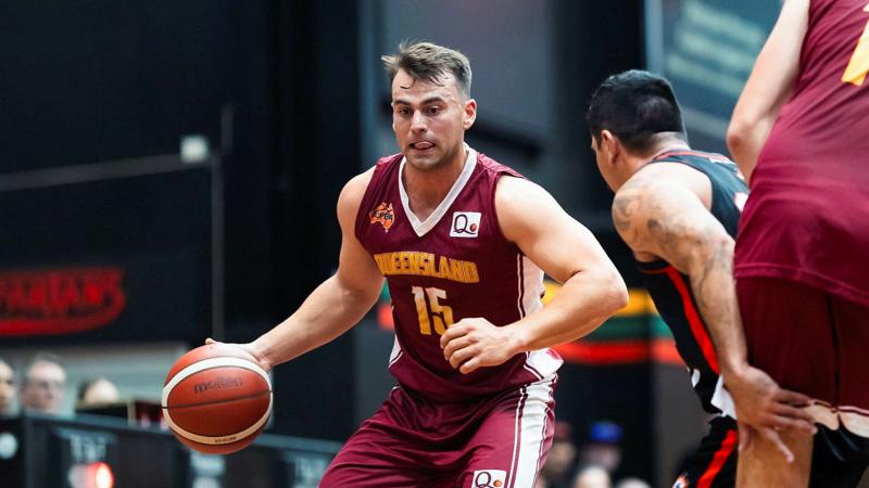 ADF Basketballer Army Lieutenant Aiden Allen handles the ball on offence during the 2026 Battle of the Badges against Queensland Fire Department on June 20.