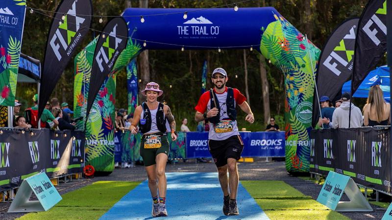 A man and a woman at the start of a race.