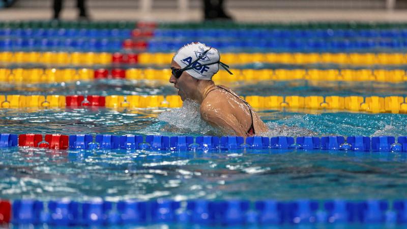 A woman competing in a swimming competition.