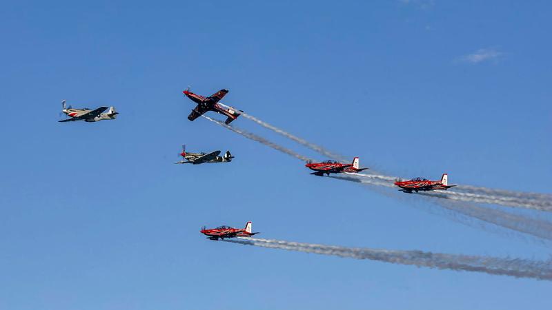 Six aircraft fly in formation.