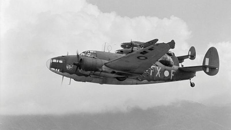 A black and white photo of three aircraft flying in formation.