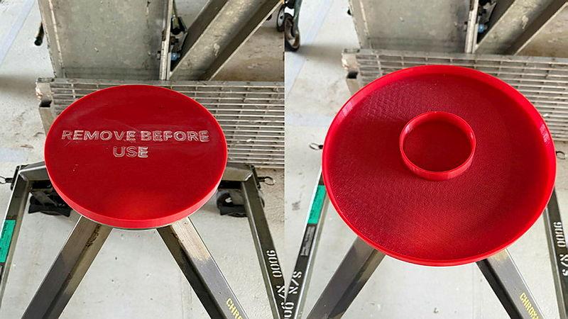 Two pictures side by side of a red, round cover that reads 'REMOVE BEFORE USE'.