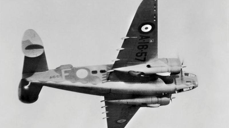Old military aircraft flies through the sky