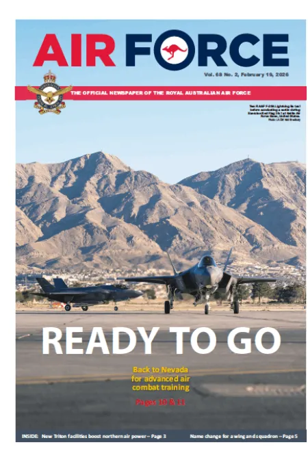 Cover of Air Force newspaper featuring two fighter jets on a runway with mountains in the background. Large headline reads “READY TO GO” with subheading about returning to Nevada for advanced air combat training.