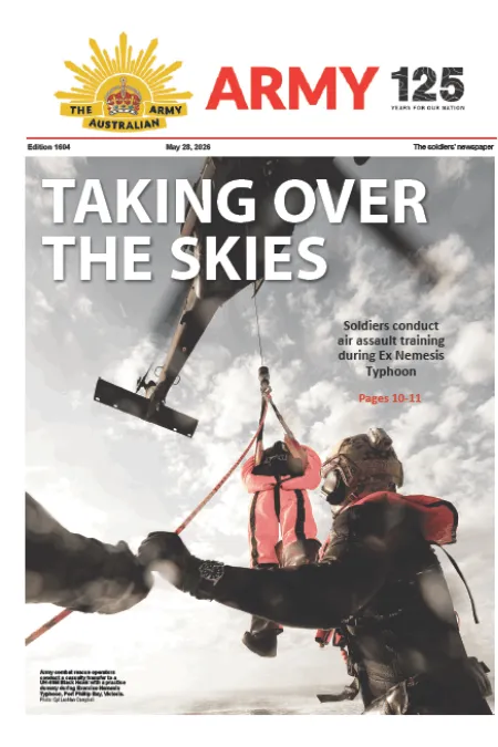 Front page of The Soldiers Newspaper showing soldiers conducting helicopter air-assault training, with one soldier being hoisted on a rope beneath a helicopter and the headline “TAKING OVER THE SKIES.”
