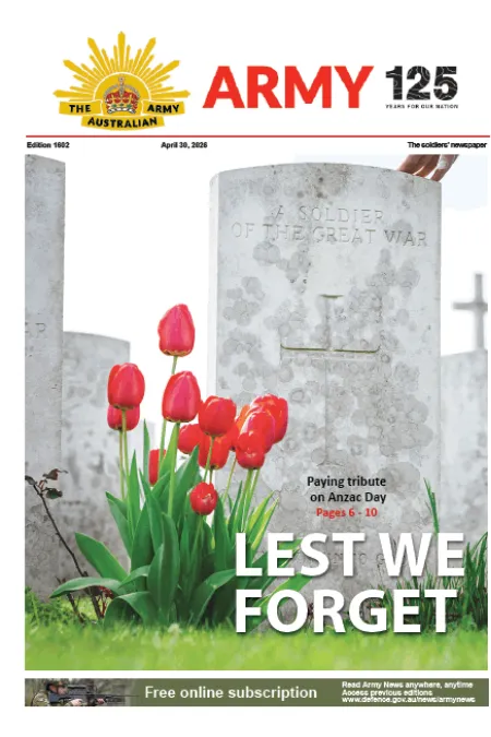Front page of The Soldiers Newspaper featuring red poppies in front of a World War I military headstone, with the headline “LEST WE FORGET.”