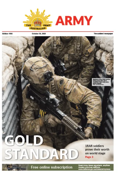 Soldiers in camouflage move through a sandbag-lined trench, with one carrying a rifle. Cover headline: “Gold Standard.”