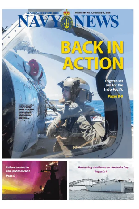 Front cover of Navy News showing a naval aviator seated in a helicopter doorway above the ocean, with the headline “BACK IN ACTION.”