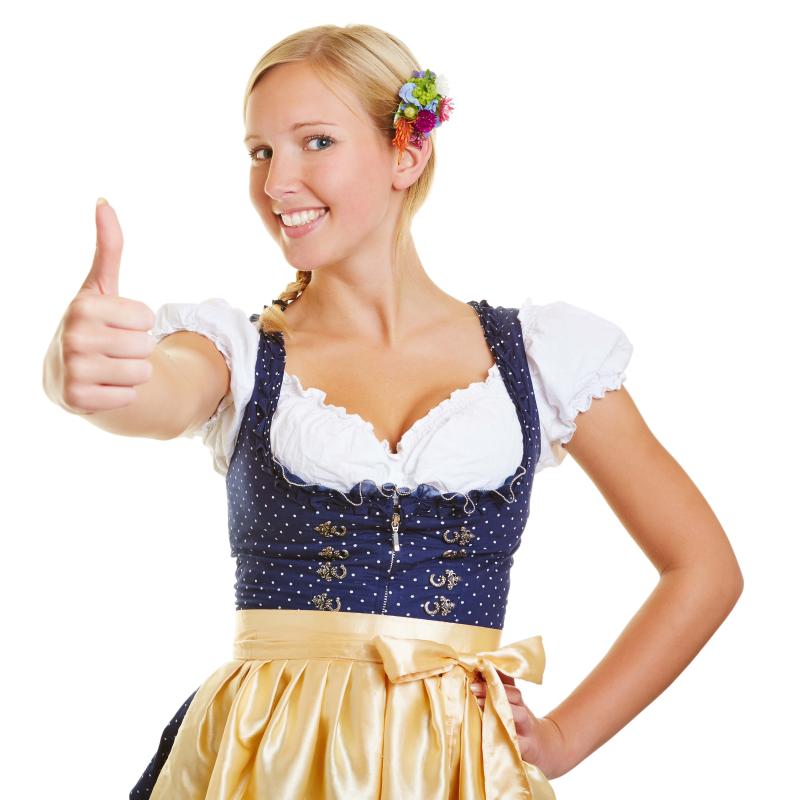 A female stands in traditional dirndl dress