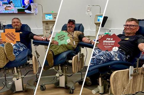 Three military men donate blood.