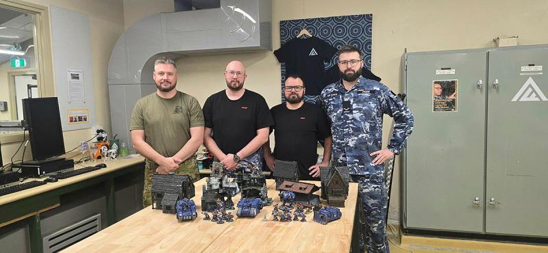 From left, RAAF Williamtown Tabletop Gaming Club members FLGOFF Kyle McComb, SQNLDR Ben Jordan, LAC Adam Fulmizi and LAC Brodie Picen.