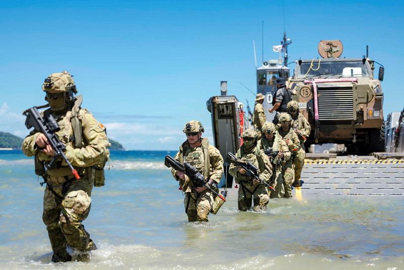 Australian Army soldiers depart a Light Landing Craft for a beach landing during Exercise Sea WADER 26.