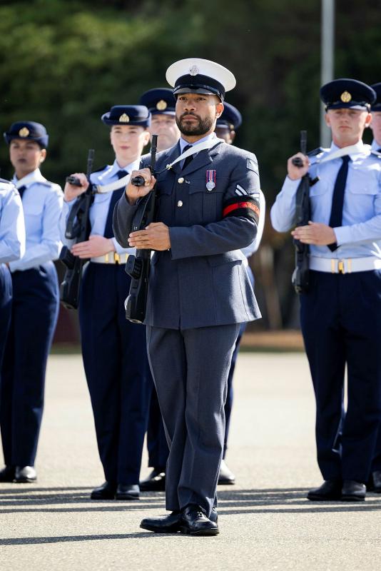 Royal Air Force Corporal Isireli Stevens performs a general salute during the No. 1 Recruit Training Unit Course 03/26 graduation parade, held at RAAF Base Wagga, NSW.