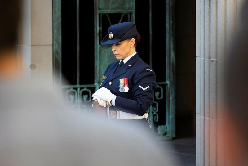 Federation Guard member, Leading Aircraftwoman Chantelle Bradford rest on arms during a Last Post Ceremony at the Australian War Memorial, Canberra.