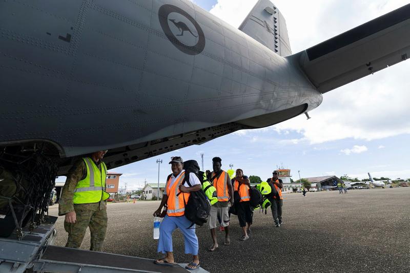 A Medical team from Honiara board a flight to Munda during the Australian Defence Force support to Solomon Islands' Government for Tropical Cyclone Maila.