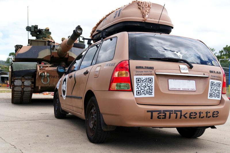 Two modified military-themed vehicles face off.