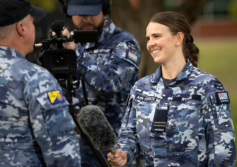 Military Public Affairs Officer, Flight Lieutenant Holly Ryan, interviews an Air Force aviator during a simulated public affairs activity as part of a training exercise.