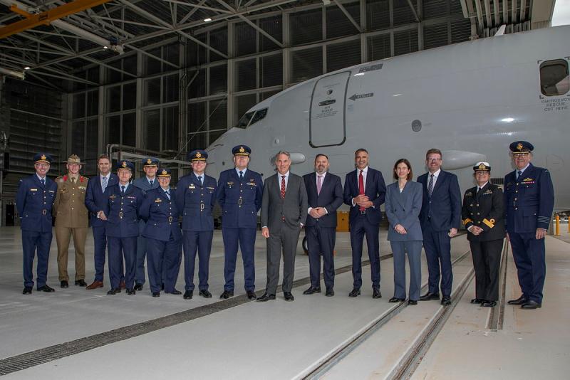 Deputy Prime Minister and Minister for Defence, the Hon. Richard Marles, MP, and Head of Aerospace systems Division, Vice-Marshal Gerry van Leeuwin, AM, CSM, stand in a group photo with all the leaders with an interest in the Deep Maintenance and Modification Facility Opening held at RAAF Base Edinburgh.