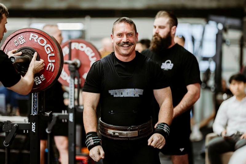 Royal Australian Air Force officer, Squadron Leader Evan McCloy during an Air Force Powerlifting competition at Adonis Athletics in Penrith, New South Wales.