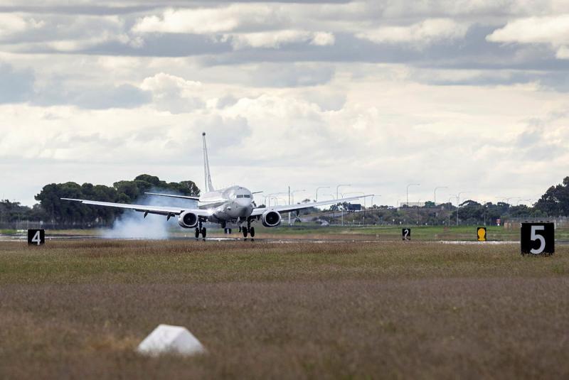 An aircraft taxis on the runway. 