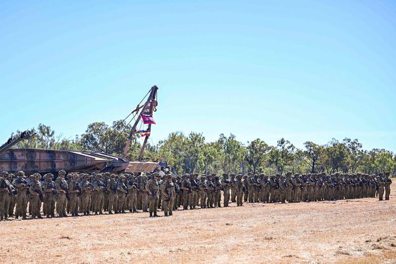 Australian Army officers and soldiers from the 3rd Brigade stand on parade during the opening ceremony of Exercise Southern Jackaroo at the Townsville Field Training Area, Queensland.