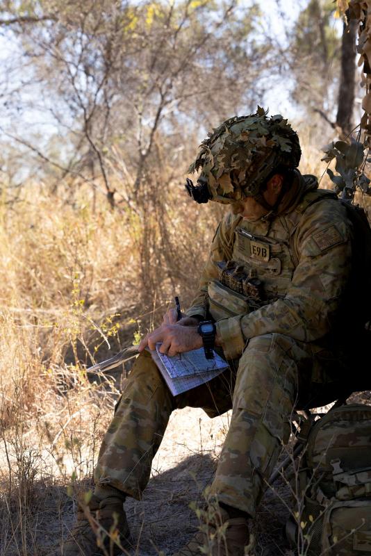 Australian Army officer Major Joseph Sorrensen from the 3rd Combat Engineer Regiment writes orders during Exercise Southern Jackaroo at Townsville Field Training Area, Queensland.
