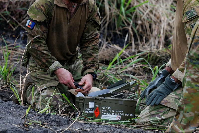 Members of the New Zealand Defence Force prepare charges to dispose of unexploded ordnance on Operation Render Safe in Rabaul, Papua New Guinea.