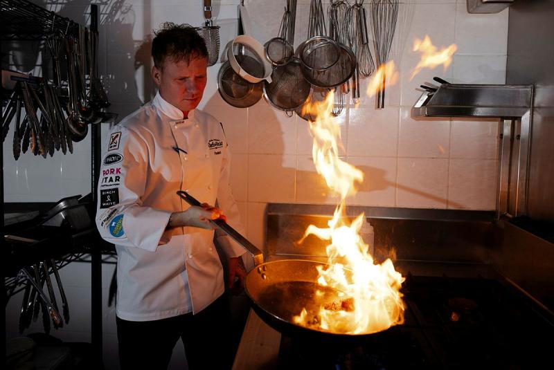 Executive chef to the Chief of Army, Sergeant Lee Kemp prepares a meal at the Russell Offices, Canberra.