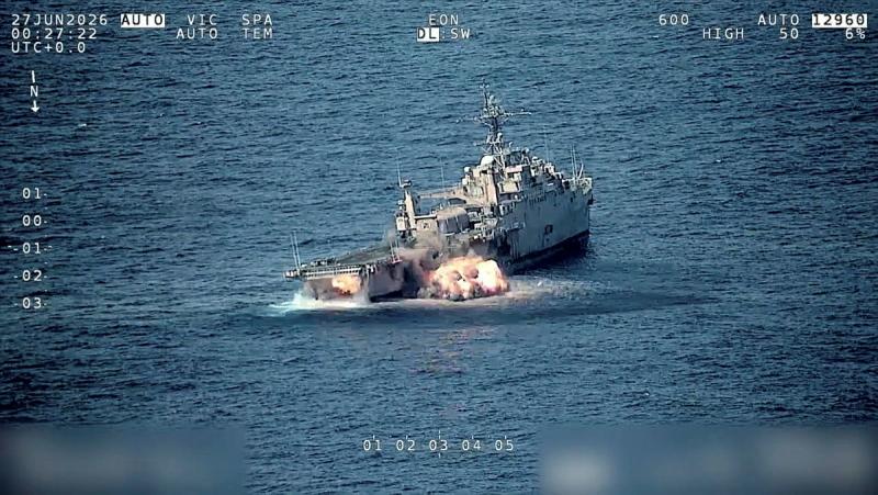 A ship is struck by something explosive and starts to sink.