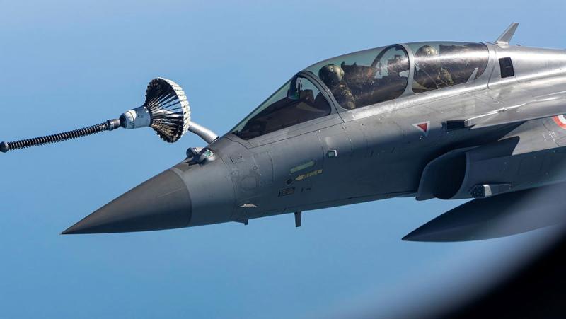 An aircraft attaches to another aircraft mid-flight.