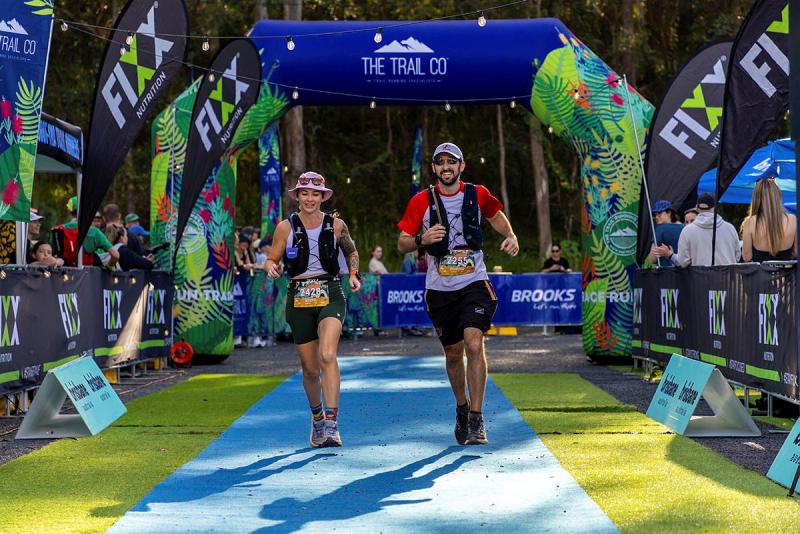 A man and a woman at the start of a race.