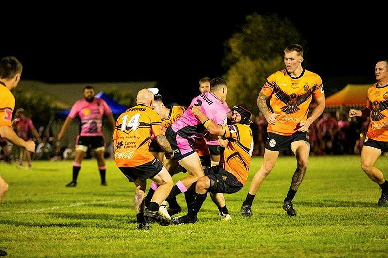 Men participate in a rugby league game.