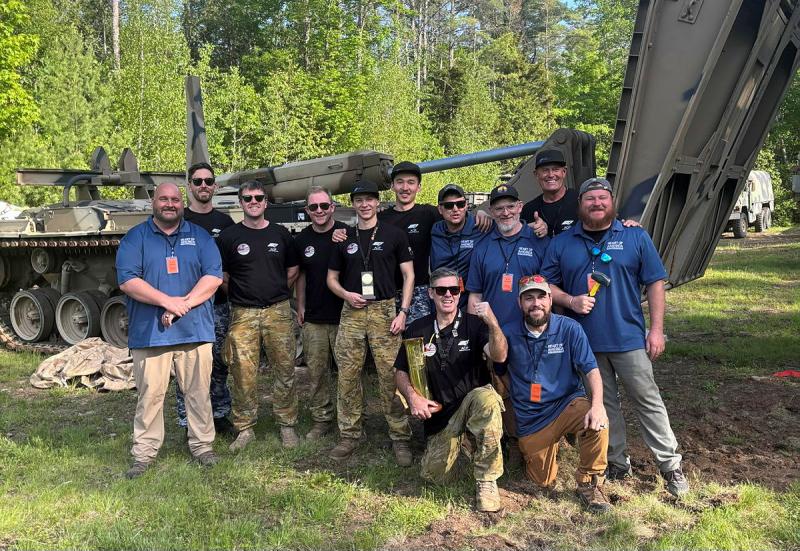 ADF Drone Racing team pilots celebrate their win with the Heart of America race organisers at the Military International Drone Racing Tournament (MIDRT_US26).