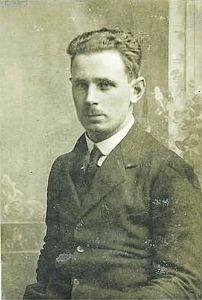 A black-and-white historical portrait of a man in a suit.