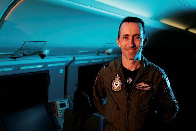 A military member inside an aircraft.