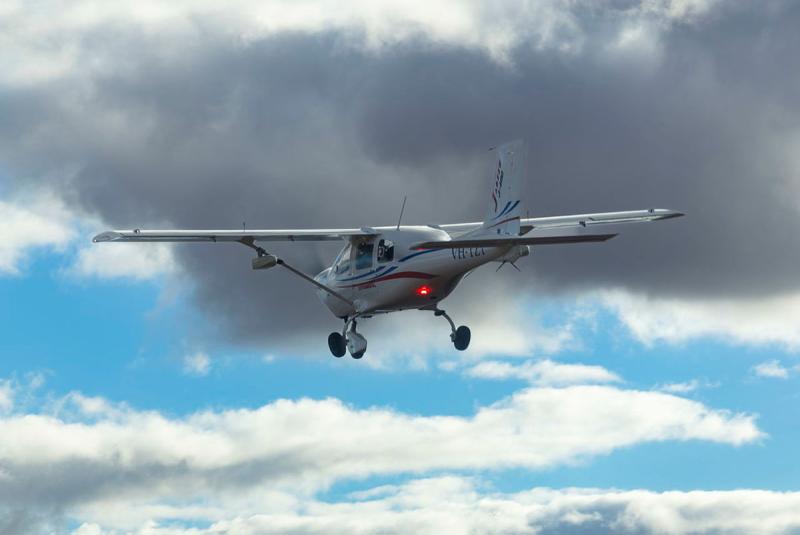 A small aircraft flying in the sky.