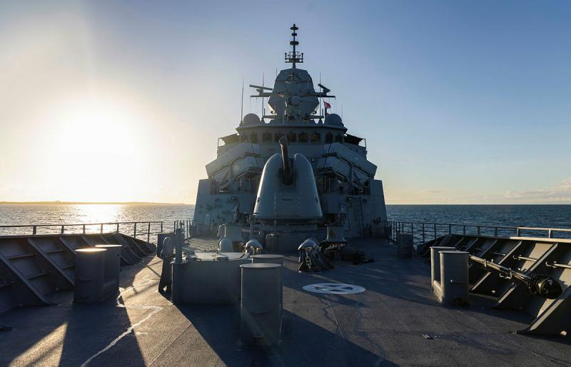 A ship at sea from the deck's perspective.