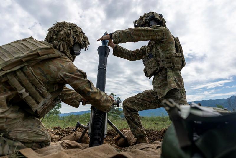 Two Australian Army officers fire a mortar during the exercise.