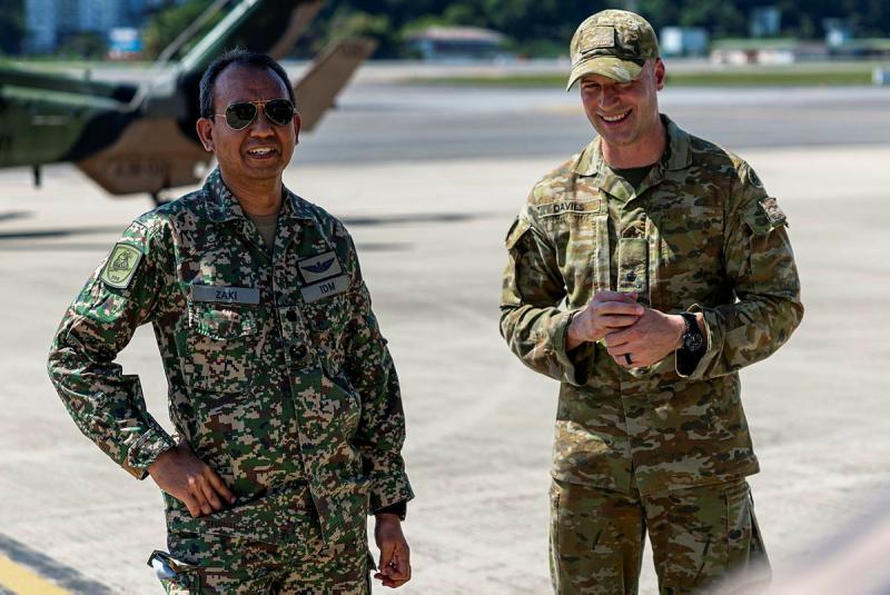 A Malaysian leader talks to an Australian Army officer during the exercise.