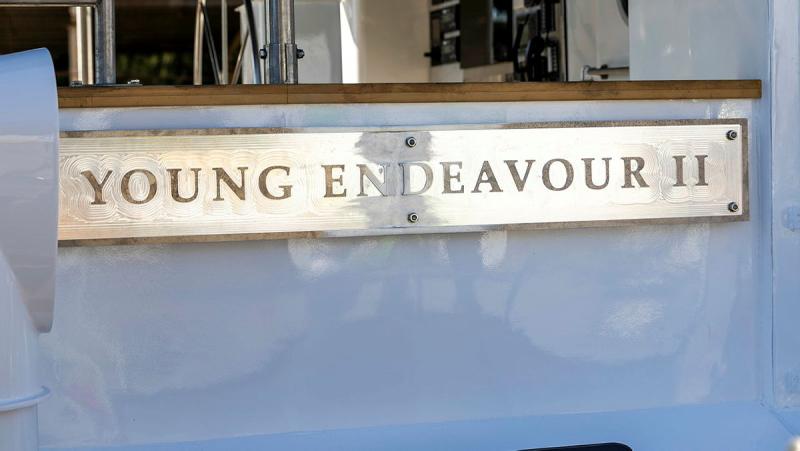 The gold Young Endeavour sign in the side of the ship.