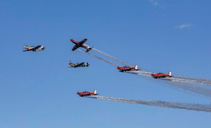 Six aircraft fly in formation.