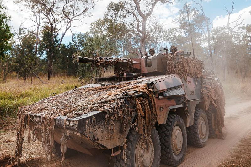 An Australian Army Boxer Combat Reconnaissance Vehicle grips a dirt road during Exercise Diamond Run.