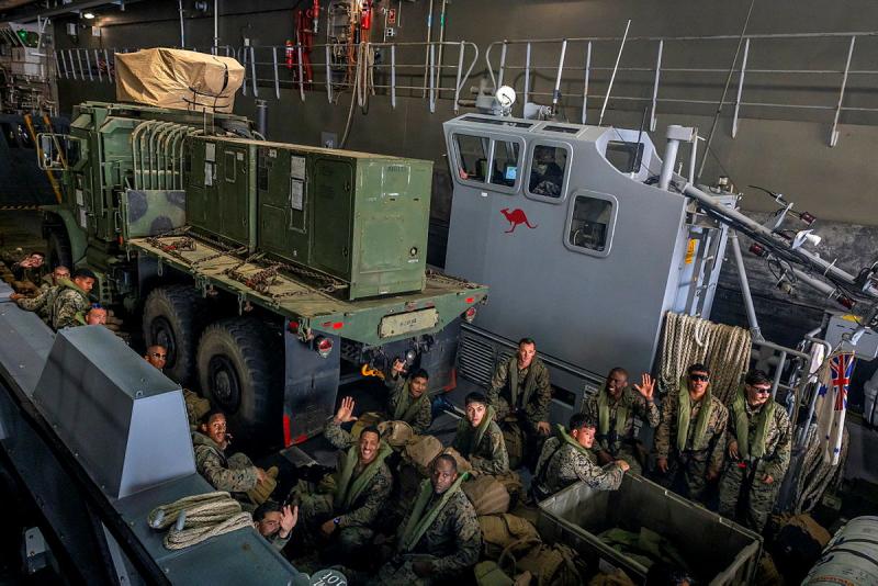 US Marine personnel and a vehicle from MRF-D onboard an LHD Landing Craft from HMAS Canberra as it prepares to depart the ship.