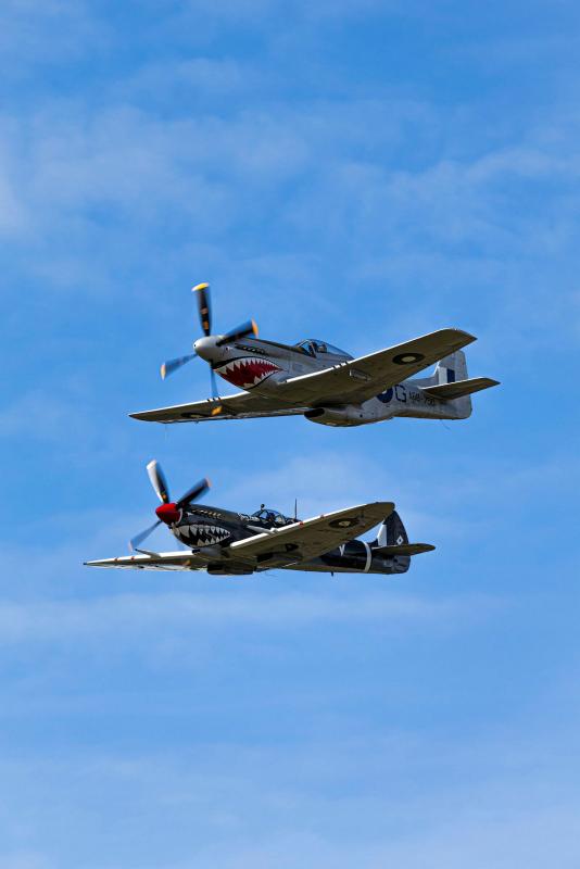 100 Squadron’s CAC CA-18 Mustang and Supermarine Spitfire Mk VIII conduct a formation display.
